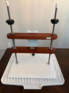 Front view of Tickbriar Precision Cheese Press showing press and draining mat